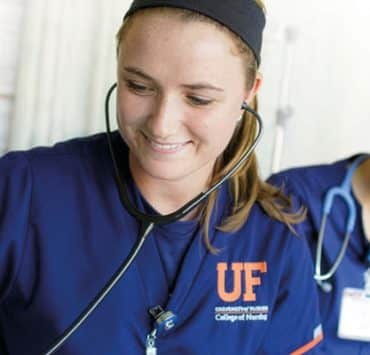 nursing students from the University of Florida College of Nursing interacting with a patient