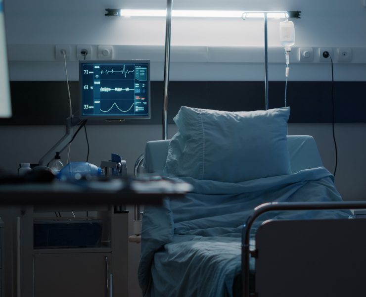 An empty hospital room representing the growing financial pressure on the American healthcare system.