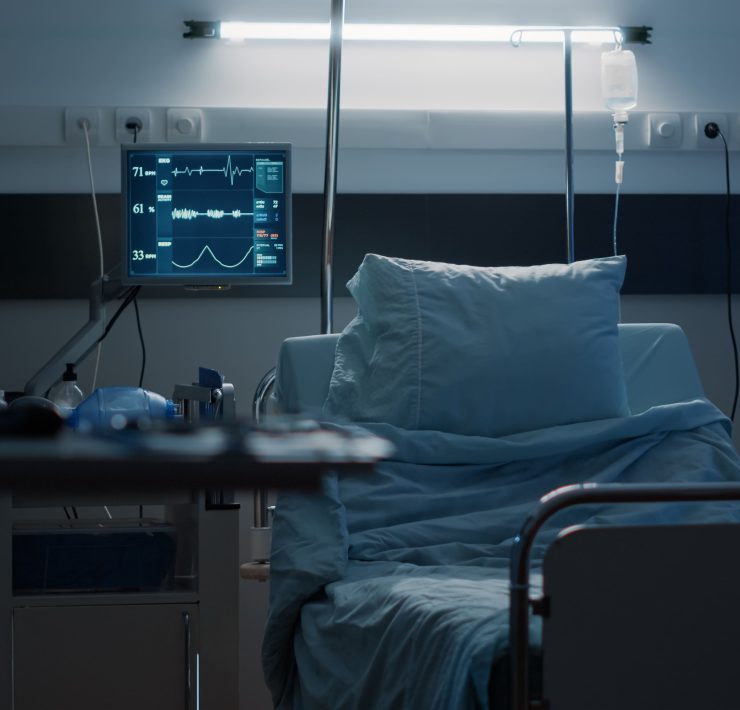 An empty hospital room representing the growing financial pressure on the American healthcare system.
