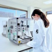 a laboratory setting featuring a pharmaceutical 3D printer