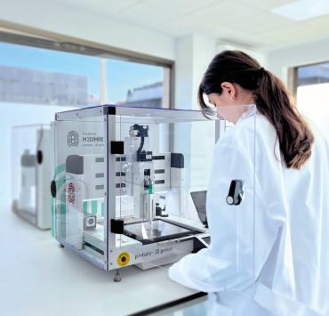 a laboratory setting featuring a pharmaceutical 3D printer