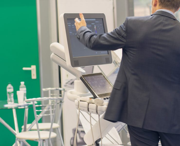 Medical device sales representative using AI-powered sales intelligence software to analyze hospital accounts and improve commercial performance.
