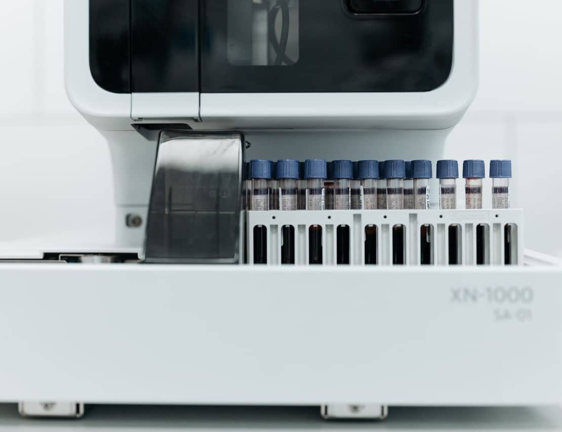 Automated laboratory equipment processing blood samples for diagnostic testing