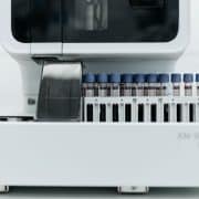 Automated laboratory equipment processing blood samples for diagnostic testing