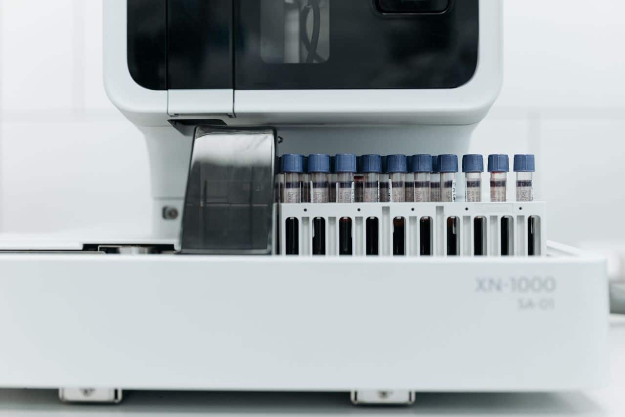 Automated laboratory equipment processing blood samples for diagnostic testing