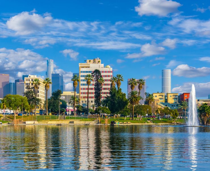 the view across MacArthur Park Lake toward the Downtown Los Angeles skyline in California