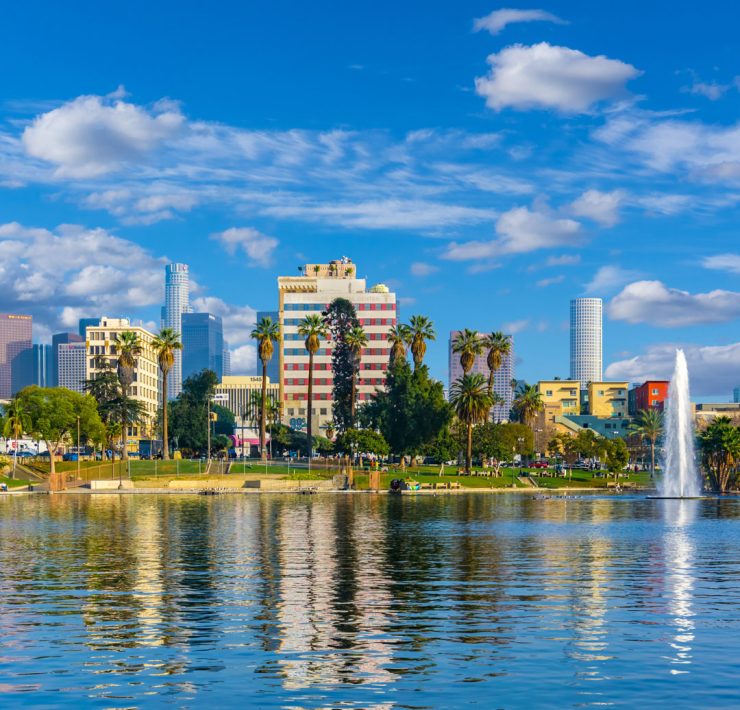 the view across MacArthur Park Lake toward the Downtown Los Angeles skyline in California