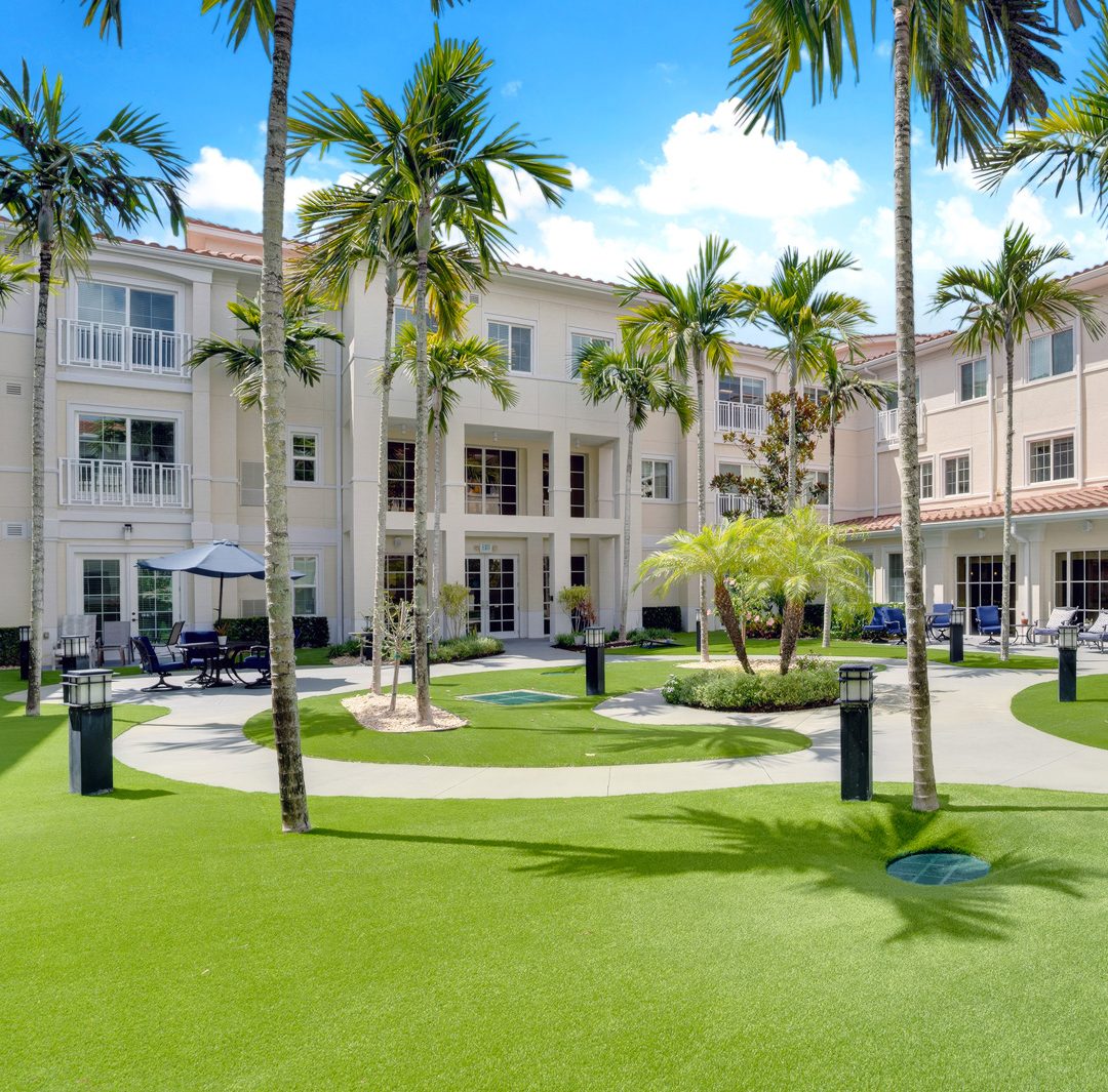 the courtyard and exterior of The Meridian at Boca Raton, a senior living community
