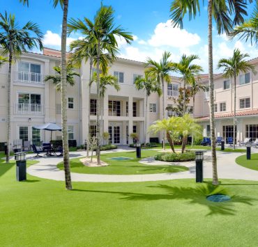 the courtyard and exterior of The Meridian at Boca Raton, a senior living community