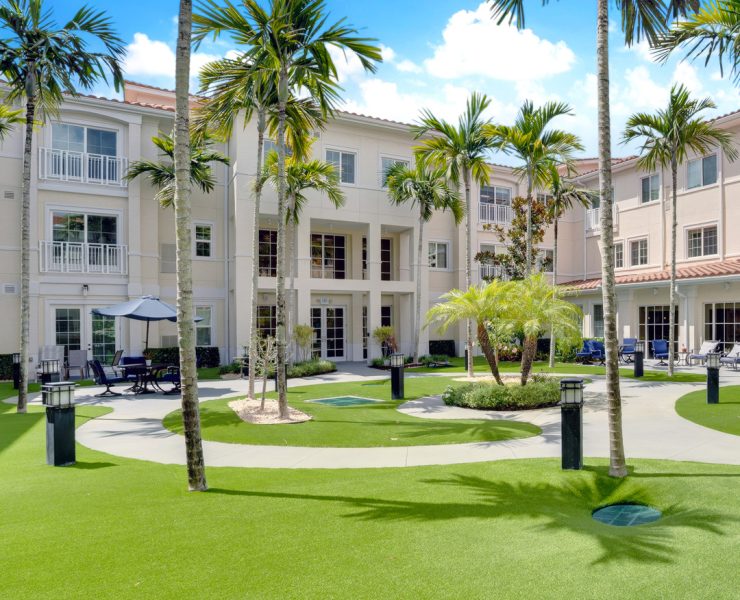 the courtyard and exterior of The Meridian at Boca Raton, a senior living community