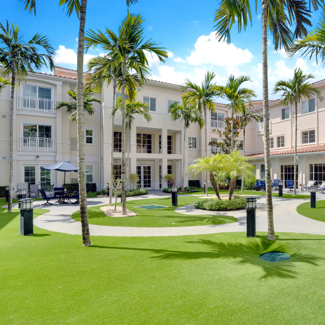 the courtyard and exterior of The Meridian at Boca Raton, a senior living community