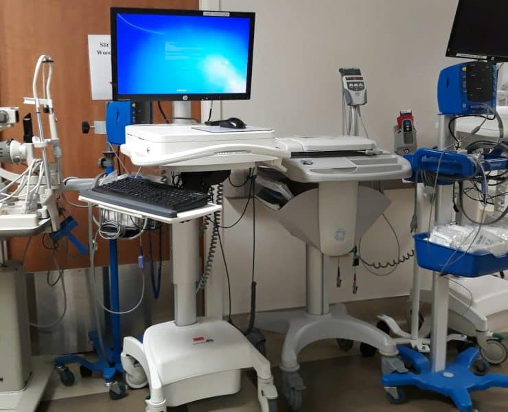 Hospital medical equipment and computer displays used to support digital communications and patient care systems.