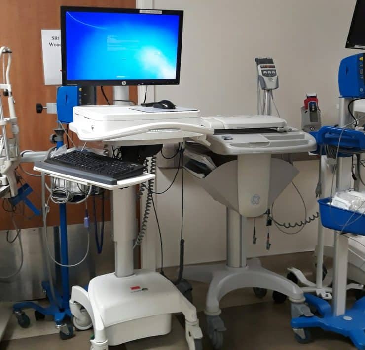 Hospital medical equipment and computer displays used to support digital communications and patient care systems.