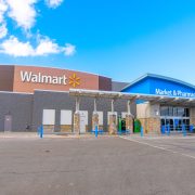 Walmart store exterior illustrating the retailer's expansion of employee healthcare benefits for 2027.